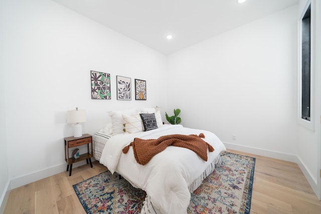 bedroom featuring recessed lighting, baseboards, and light wood finished floors