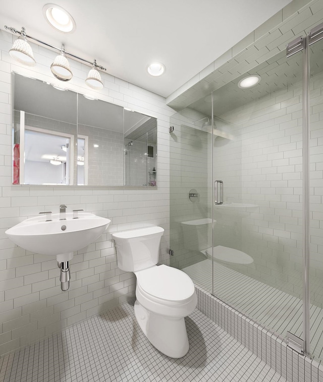 380 Mountain Rd Unit 1906-1907, Union City, NJ 07087 - bathroom featuring tile patterned flooring, a shower stall, and tile walls
