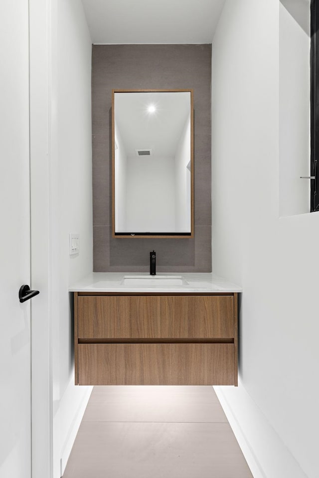 bathroom featuring visible vents and vanity