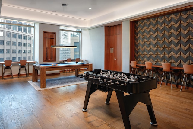 recreation room with pool table, wood-type flooring, and plenty of natural light