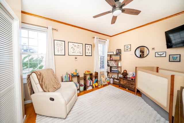 176 Webster Ave Unit 2L, Jersey City, NJ 07307 - sitting room with a ceiling fan, crown molding, and wood finished floors