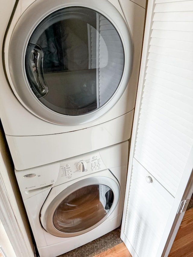 176 Webster Ave Unit 2L, Jersey City, NJ 07307 - washroom featuring light wood finished floors, laundry area, and stacked washer / dryer