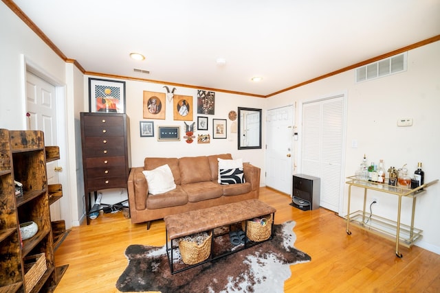 176 Webster Ave Unit 2L, Jersey City, NJ 07307 - living room with crown molding, light wood finished floors, and visible vents