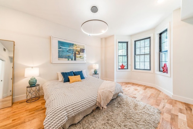 bedroom featuring light wood-type flooring