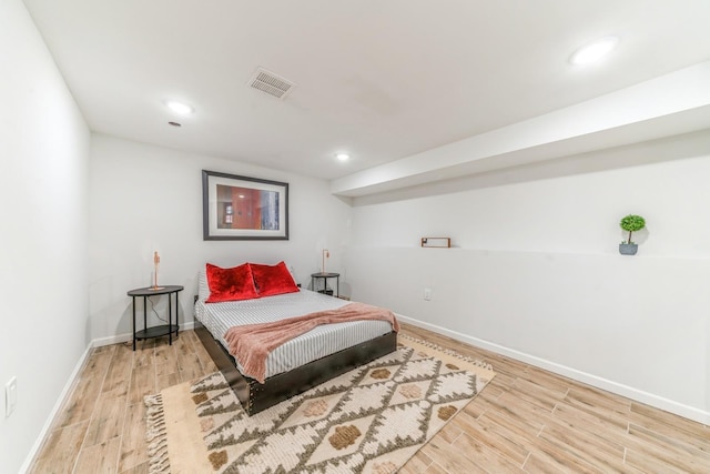 bedroom with wood-type flooring