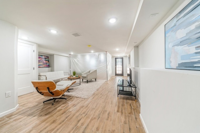 corridor with light hardwood / wood-style flooring