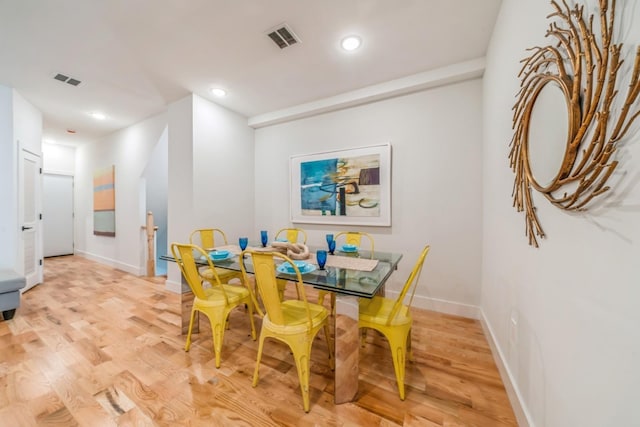 dining area featuring light wood-type flooring