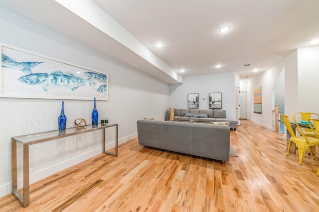 living room with light hardwood / wood-style flooring