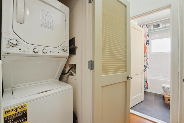 390 1st St Unit 2, Jersey City, NJ 07302 - laundry area with stacked washer / dryer