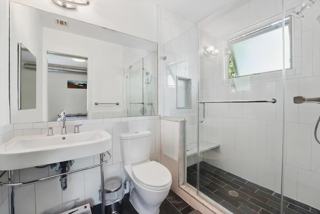 390 1st St Unit 2, Jersey City, NJ 07302 - bathroom with toilet, a sink, and a stall shower