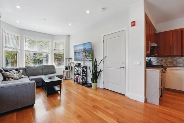 390 1st St Unit 2, Jersey City, NJ 07302 - living area with light wood-style floors and recessed lighting
