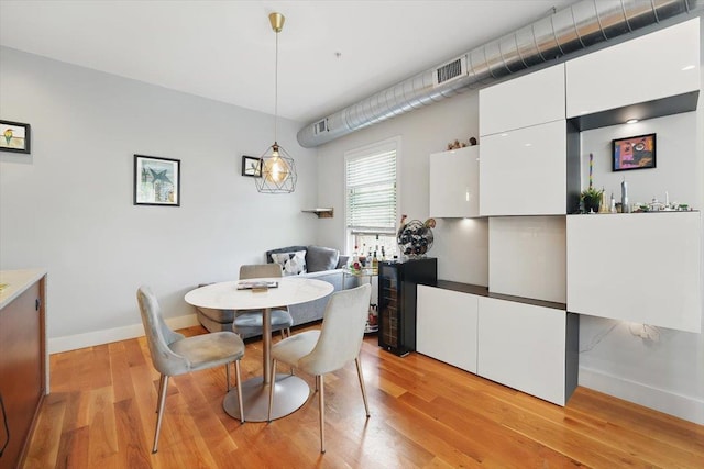 390 1st St Unit 2, Jersey City, NJ 07302 - dining space featuring baseboards and light wood-style flooring
