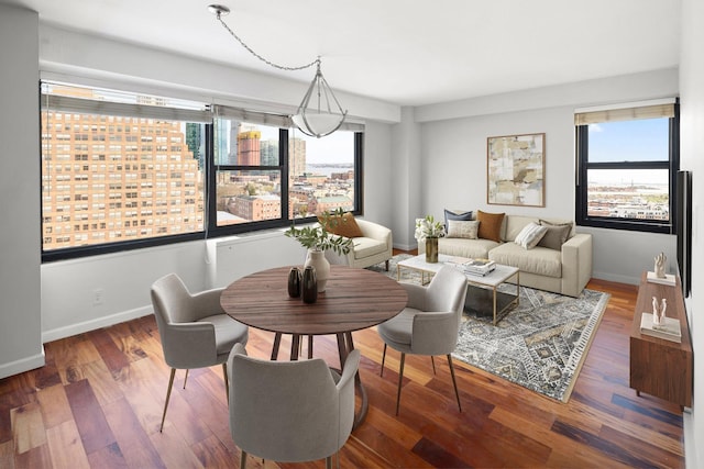 135 Montgomery St Unit A-19, Jersey City, NJ 07302 - dining area with baseboards and wood finished floors