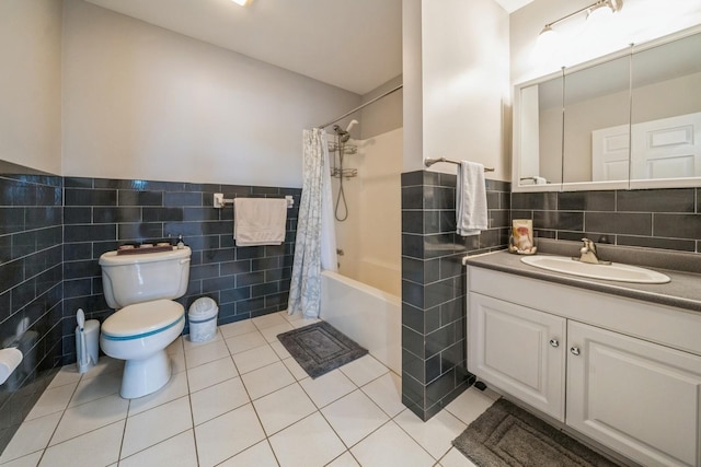 8915 Bergenwood Ave Unit 48, North Bergen, NJ 07047 - full bathroom featuring tile walls, toilet, vanity, tile patterned flooring, and shower / tub combo