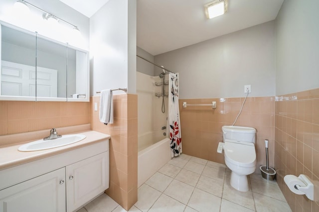 8915 Bergenwood Ave Unit 48, North Bergen, NJ 07047 - bathroom with tile walls, toilet, vanity, tile patterned floors, and shower / bath combo