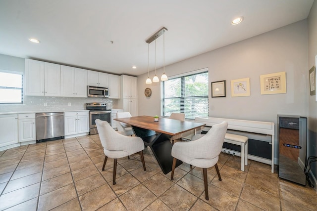 8915 Bergenwood Ave Unit 48, North Bergen, NJ 07047 - dining area featuring beverage cooler, recessed lighting, and a chandelier