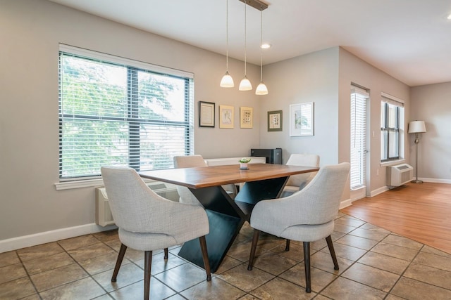 8915 Bergenwood Ave Unit 48, North Bergen, NJ 07047 - dining room with healthy amount of natural light, baseboards, tile patterned flooring, recessed lighting, and an AC wall unit
