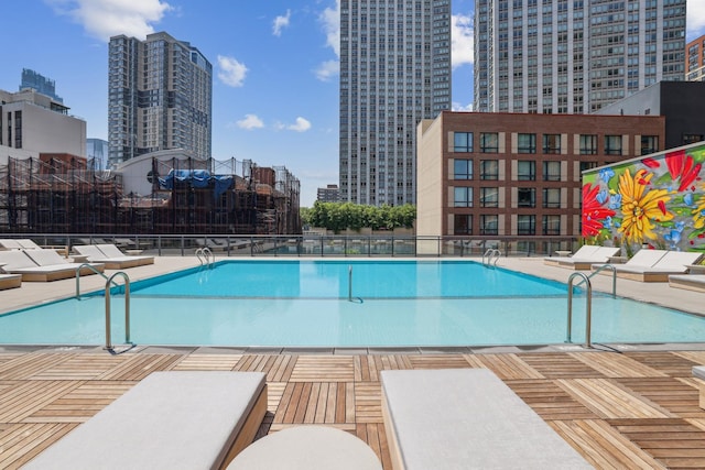 view of pool featuring a patio