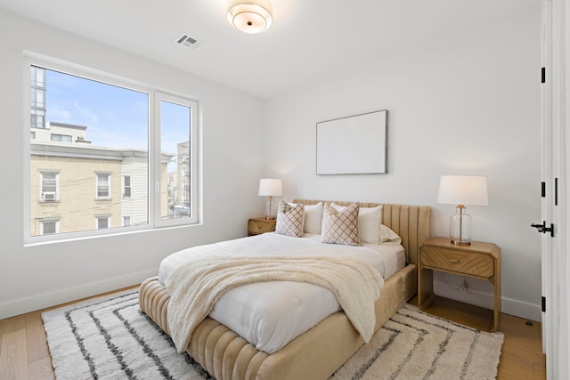 35 Orchard St Unit 301, Jersey City, NJ 07306 - bedroom featuring baseboards, visible vents, and wood finished floors