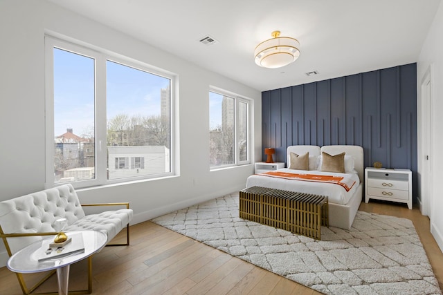 35 Orchard St Unit 301, Jersey City, NJ 07306 - bedroom with baseboards, visible vents, and wood finished floors