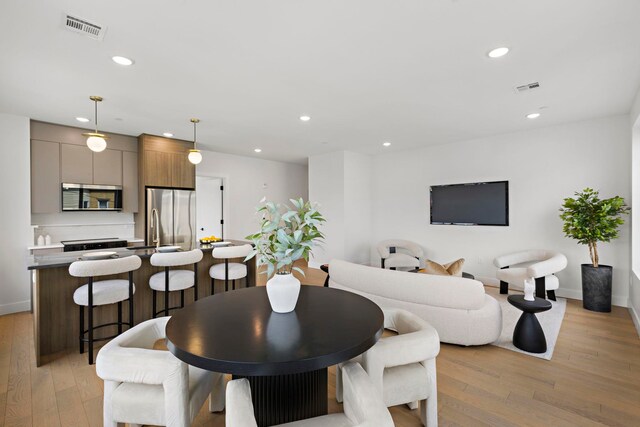 35 Orchard St Unit 301, Jersey City, NJ 07306 - dining area with recessed lighting, light wood-style flooring, and visible vents