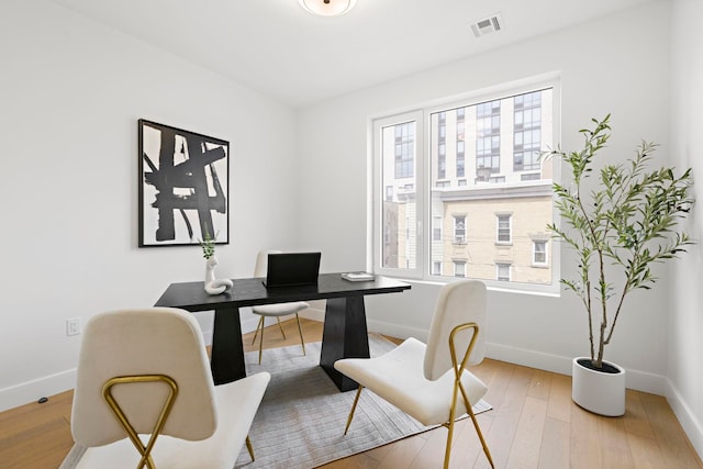 35 Orchard St Unit 301, Jersey City, NJ 07306 - office area featuring visible vents, baseboards, and wood finished floors