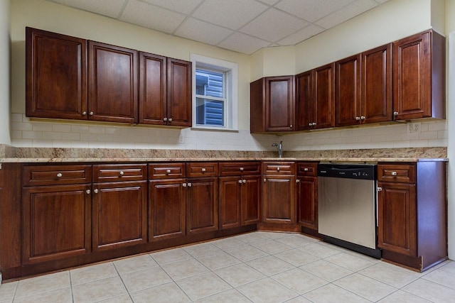 12 W 31st St, Bayonne, NJ 07002 - kitchen featuring dishwasher, a drop ceiling, a sink, tasteful backsplash, and light stone counters