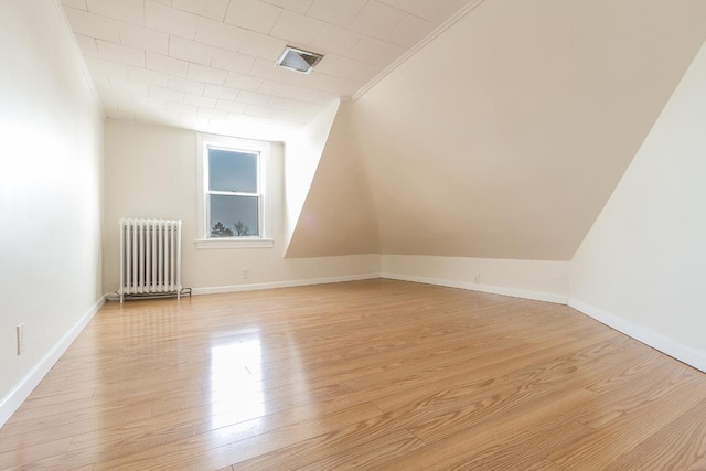 12 W 31st St, Bayonne, NJ 07002 - additional living space featuring radiator heating unit, light wood-style flooring, and baseboards