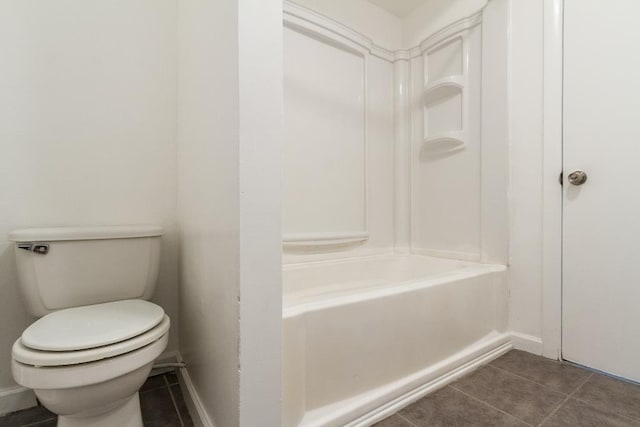 12 W 31st St, Bayonne, NJ 07002 - full bath with tile patterned flooring, toilet, baseboards, and shower / washtub combination