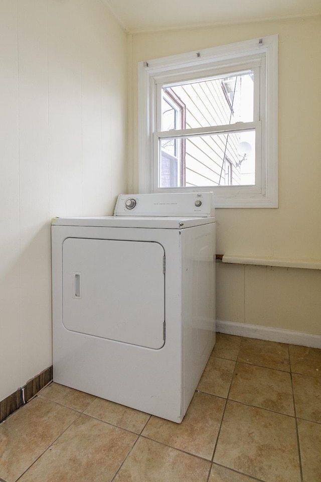 12 W 31st St, Bayonne, NJ 07002 - laundry area featuring washer / dryer, healthy amount of natural light, baseboards, and light tile patterned flooring