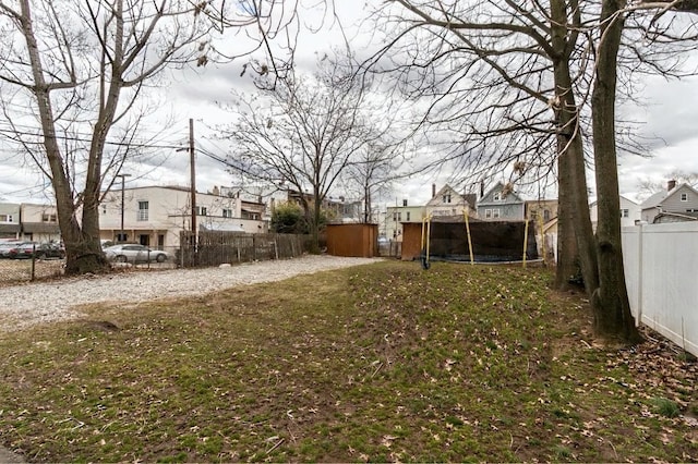 12 W 31st St, Bayonne, NJ 07002 - view of yard featuring a trampoline and a residential view