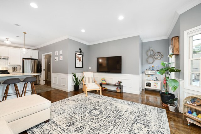 4 Sherman Ave Unit 1, Jersey City, NJ 07307 - living room with crown molding, dark wood-type flooring, recessed lighting, a decorative wall, and a wainscoted wall