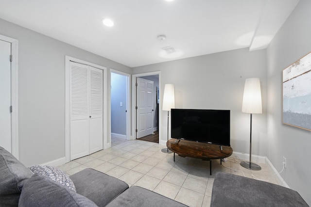 4 Sherman Ave Unit 1, Jersey City, NJ 07307 - living room featuring light tile patterned floors and baseboards