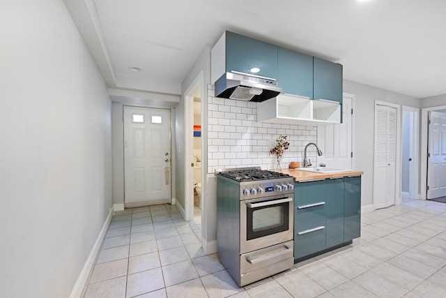 4 Sherman Ave Unit 1, Jersey City, NJ 07307 - kitchen featuring stainless steel stove, exhaust hood, blue cabinetry, decorative backsplash, and recessed lighting