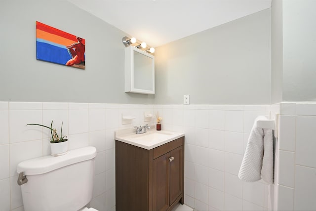 4 Sherman Ave Unit 1, Jersey City, NJ 07307 - half bathroom featuring vanity, wainscoting, and tile walls
