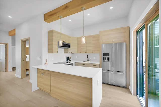 2505 Palisade Ave, Union City, NJ 07087 - kitchen with stainless steel appliances, a sink, light brown cabinets, light wood-type flooring, and recessed lighting