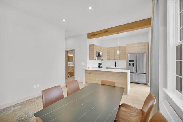 2505 Palisade Ave, Union City, NJ 07087 - dining space with radiator heating unit, recessed lighting, beamed ceiling, and baseboards