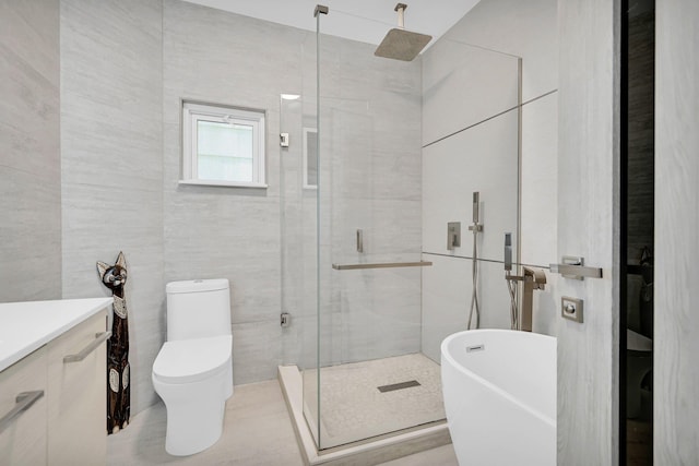 2505 Palisade Ave, Union City, NJ 07087 - full bath with tile walls, a shower stall, toilet, vanity, and a freestanding tub