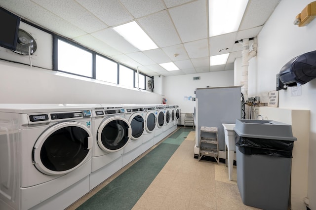 135 Montgomery St Unit 6D, Jersey City, NJ 07302 - communal laundry room with light floors and washing machine and dryer