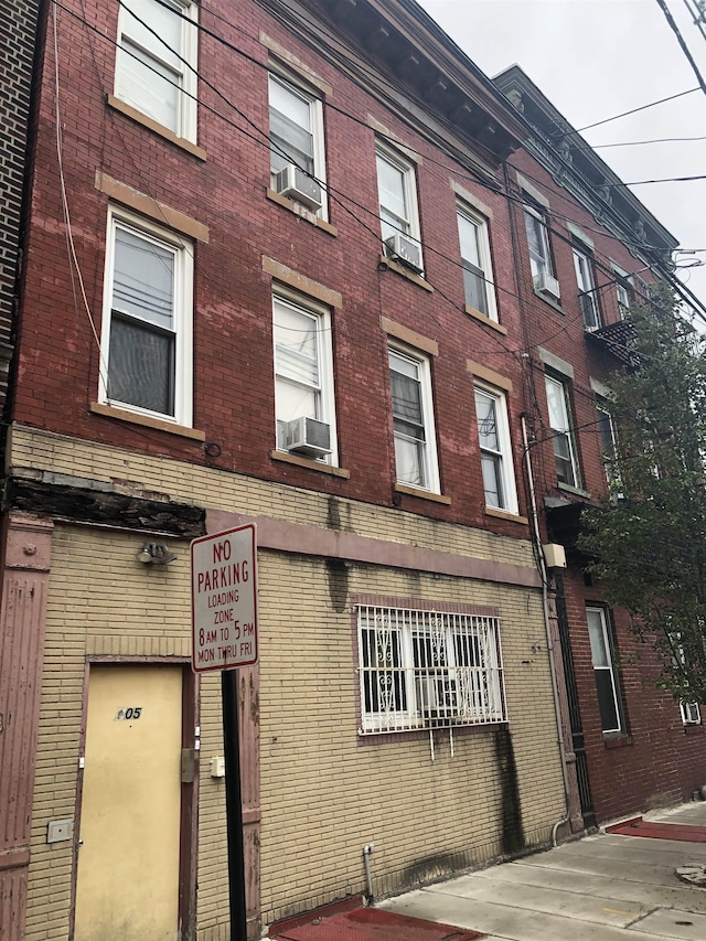 view of building exterior with cooling unit