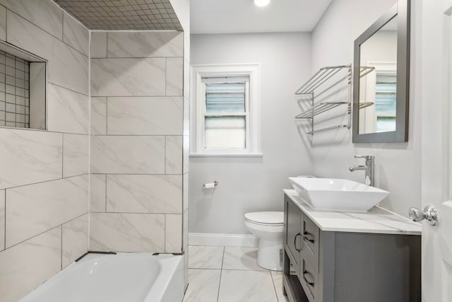 bathroom featuring marble finish floor, toilet, vanity, and baseboards