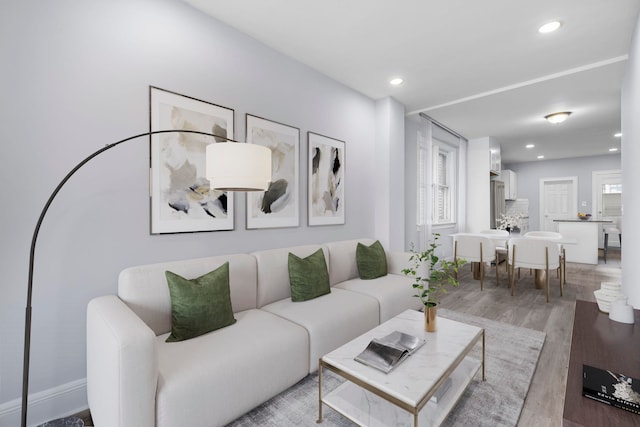 living area featuring recessed lighting and wood finished floors