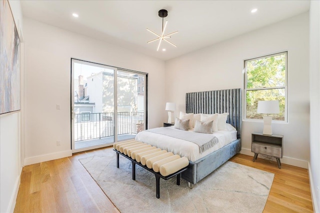 bedroom featuring a chandelier, recessed lighting, baseboards, access to outside, and light wood-type flooring