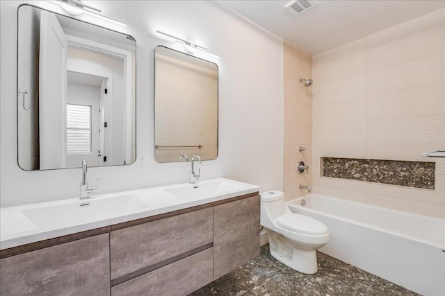 bathroom featuring toilet, bathtub / shower combination, a sink, and visible vents