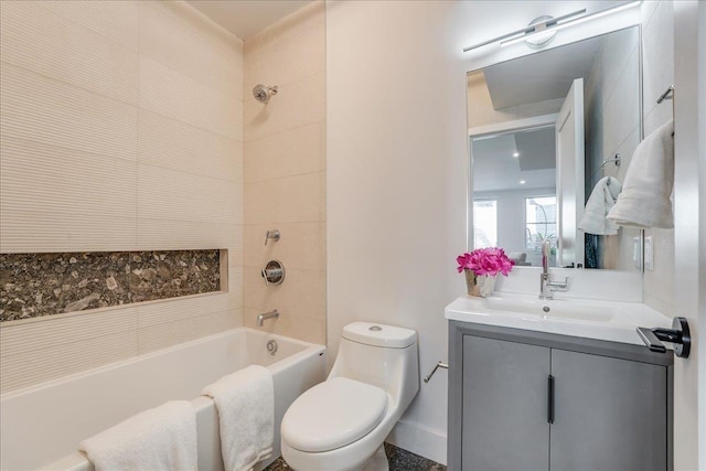 bathroom featuring toilet, washtub / shower combination, and vanity