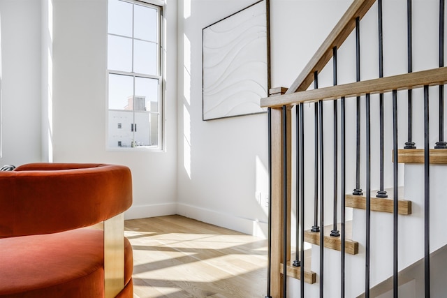 interior space featuring baseboards and wood finished floors