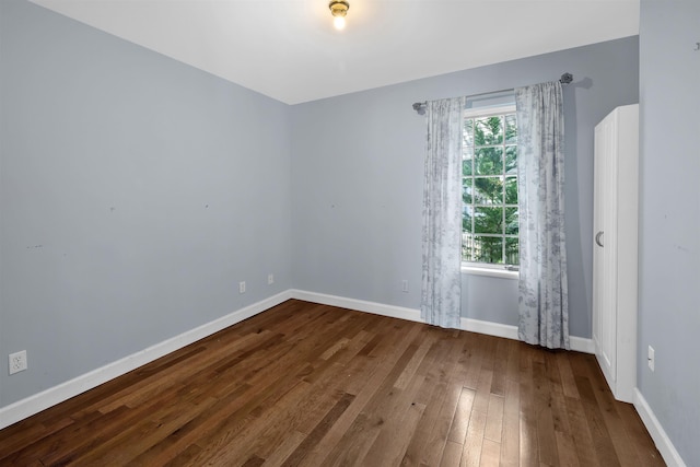 spare room featuring hardwood / wood-style flooring