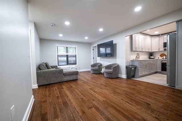 327 71st St Unit 1E, Guttenberg, NJ 07093 - living area with baseboards, recessed lighting, and wood finished floors