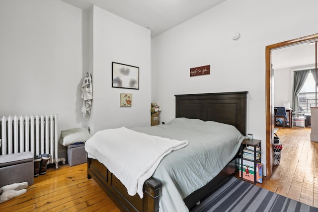 914 Washington St, Hoboken, NJ 07030 - bedroom featuring radiator and light wood finished floors
