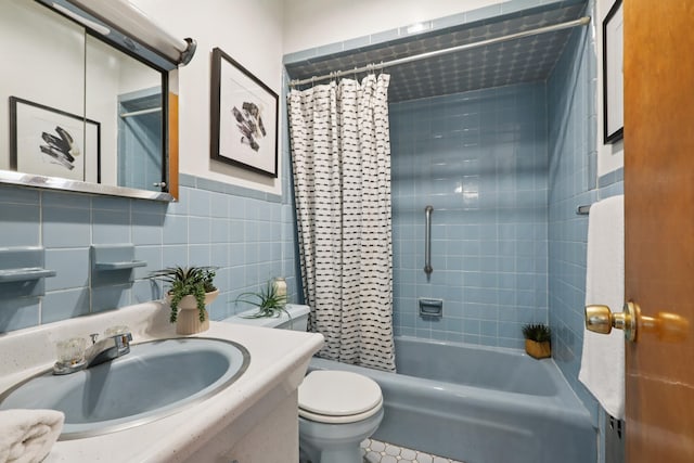 914 Washington St, Hoboken, NJ 07030 - bathroom with vanity, shower / tub combo, and tile walls